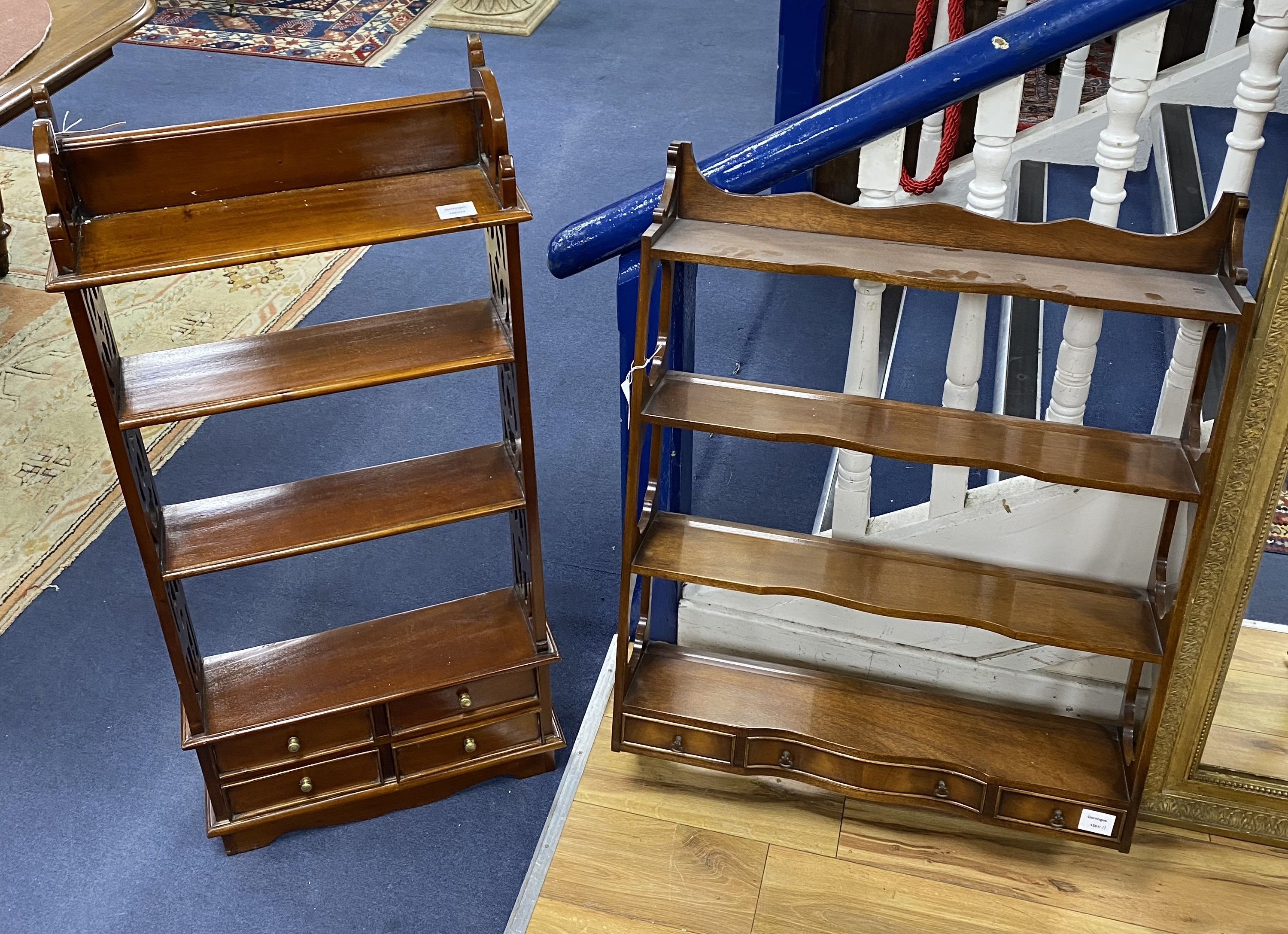 Two mahogany wall brackets, larger width 69cm, height 93cm